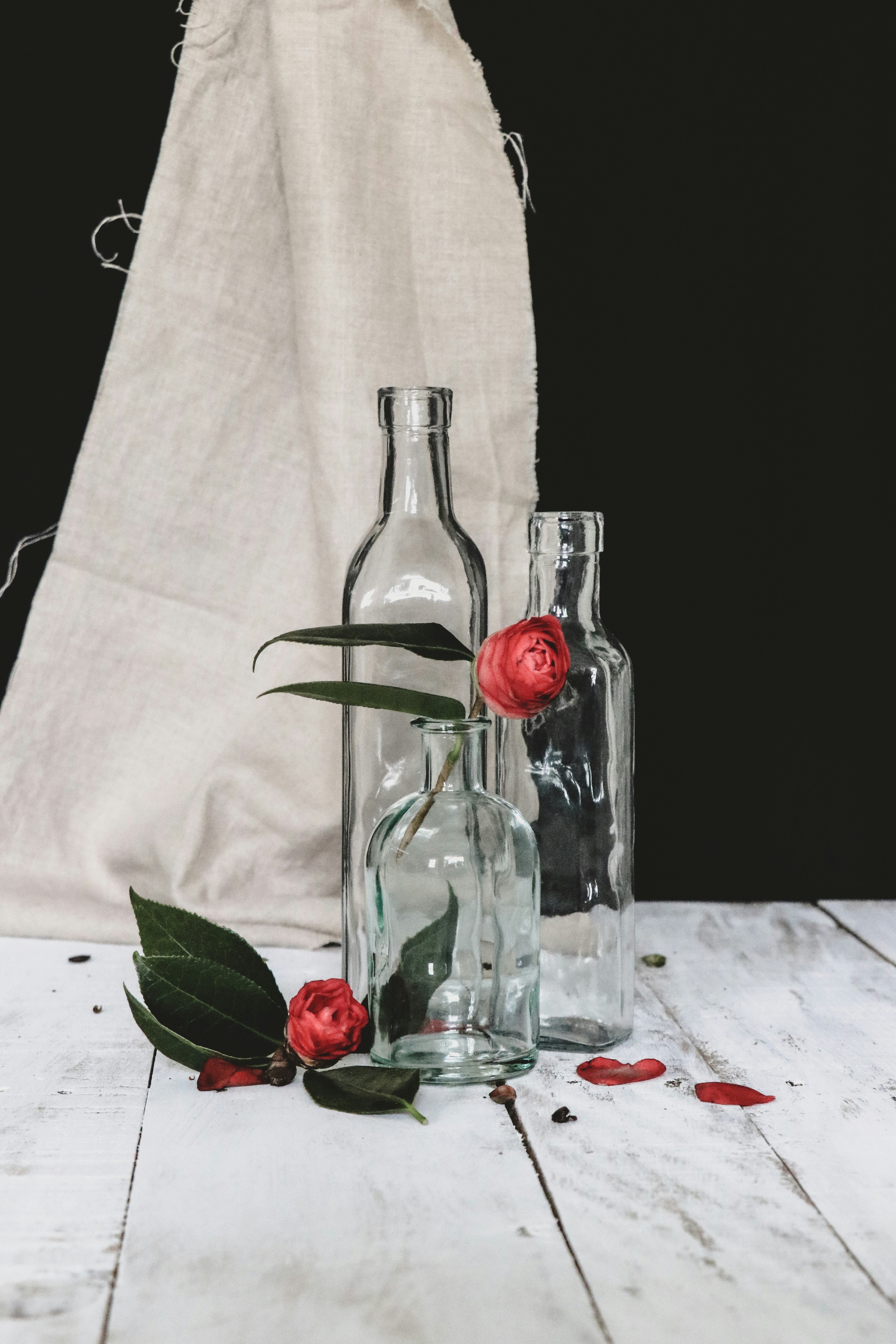 clear glass bottle with red liquid